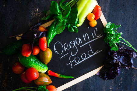 Fresh vegetables on the old wooden tableの写真素材