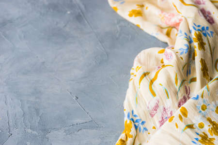 Kitchen towel or napkin over the rustic wooden table. View from above with copy space