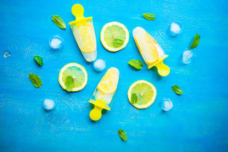Summer dessert with lemon and mint on rustic wooden background with copyspaceの写真素材