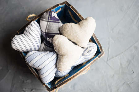 busket full of hearts on rustic concrete background with copyspaceの写真素材