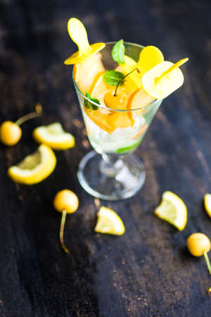 Summer dessert with lemon and mint on rustic wooden background with copyspaceの写真素材