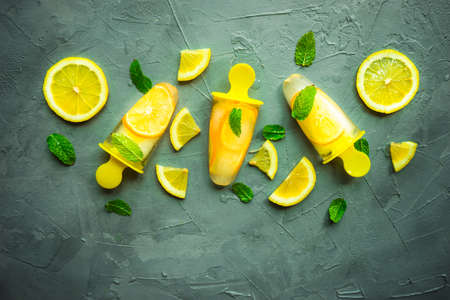 Summer dessert with lemon and mint on rustic wooden background with copyspaceの写真素材