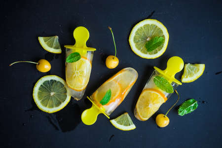 Summer dessert with lemon and mint on rustic wooden background with copyspaceの写真素材