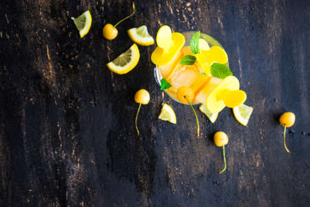 Summer dessert with lemon and mint on rustic wooden background with copyspaceの写真素材