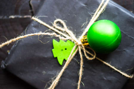 Christmas festive decorated gifts on wooden background