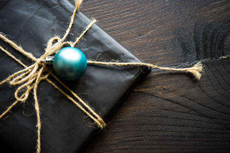 Christmas festive decorated gifts on wooden background, selective focus and copyspaceの写真素材