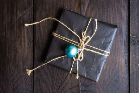 Christmas festive decorated gifts on wooden background, selective focus and copyspace