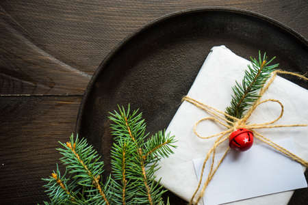 Festive table setting for Christmas holiday dinner with vintage flatware and decorationの写真素材