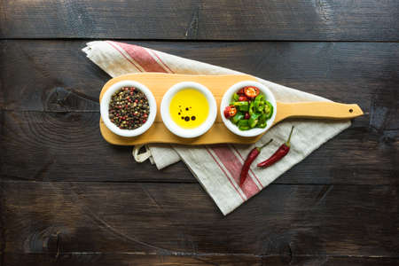 organic spices for salads - pepper corn, pepper, and oil with soy