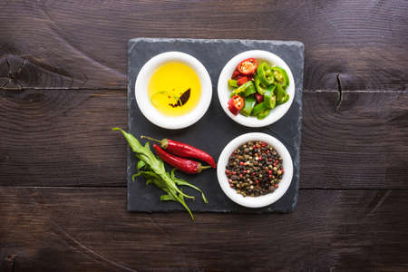 organic spices for salads - pepper corn, pepper, and oil with soyの写真素材