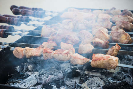 Fried meat. Georgian mtsvadi (Shashlik) preparation. Smoking shashlik. Tasty food.の写真素材