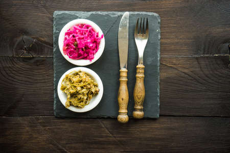 Traditional georgian salads and ingredients as a hot chili pepper, sour red cabbage and jonjoli or...