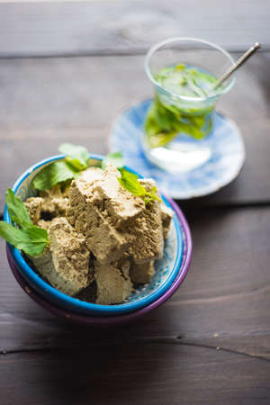 Traditional turkish sweets - pahlava with fresh mint leaves and mint teaの写真素材