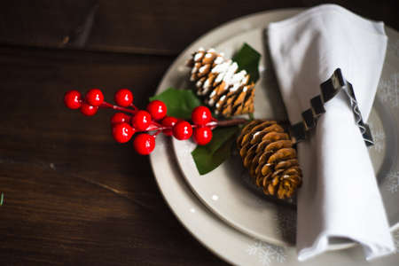 Festive table setting for Christmas holiday dinner with vintage flatware and decorationの写真素材