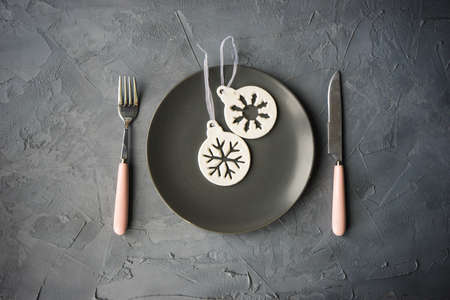 Festive table setting for Christmas holiday dinner with vintage flatware and decoration