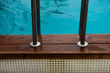 Blue swimming pool rippled water detail as a relax concept