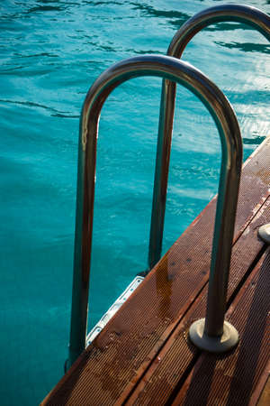 Blue swimming pool rippled water detail as a relax concept