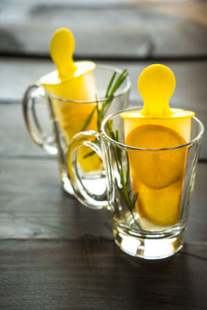 Summer dessert with lemon and mint on rustic wooden background with copyspaceの写真素材
