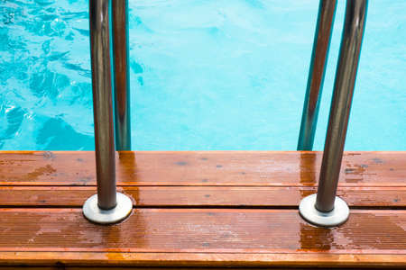 Blue swimming pool rippled water detail as a relax concept