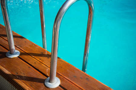 Blue swimming pool rippled water detail as a relax concept