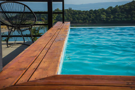 Blue swimming pool rippled water detail as a relax concept