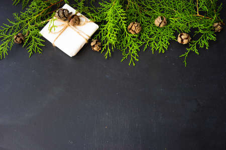 Festive Christmas frame with christmas tree branches and decoration with copyspaceの写真素材