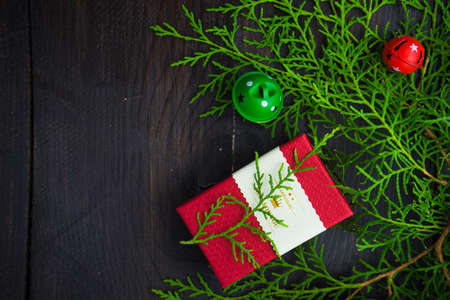Christmas sweets and gift boxes on rustic background with copyspace