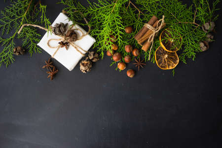 Festive Christmas frame with christmas tree branches and decoration with copyspaceの写真素材