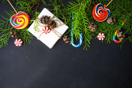 Festive Christmas frame with christmas tree branches and decoration with copyspaceの写真素材