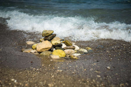 Summertime relax on the sand beach with sea wavesの写真素材