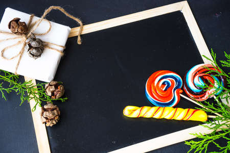 Festive Christmas frame with christmas tree branches and decoration with copyspaceの写真素材