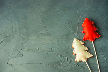 Red christmas decor on grey concrete background with copyspaceの写真素材