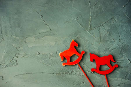 Red christmas decor on grey concrete background with copyspaceの写真素材