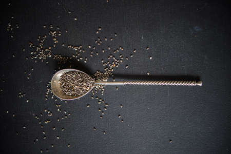 Organic chia seeds on dark wooden table with copyspaceの写真素材