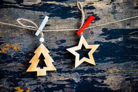 Christmas frame with wooden rustic toys on dark wooden background