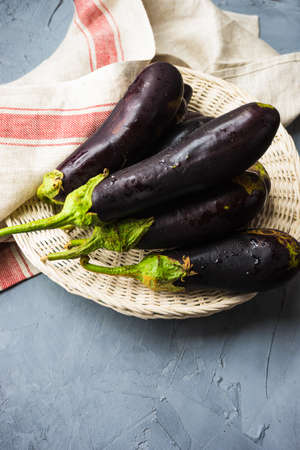 organic food concept with fresh uncooked eggplant on concrete backgoundの写真素材