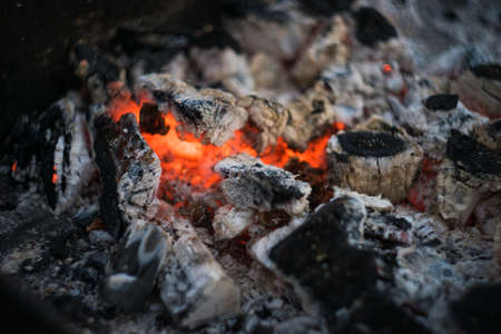 Burning charcoal with fire in a grill placeの写真素材