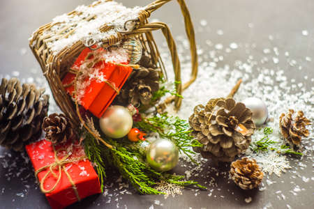 Festive Christmas concept with snow and decoration on rustic flatlay and frame with copyspaceの写真素材