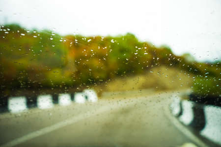 Defocused road in rainy autumnal landscape in Caucasus mountain in Kakheti, wine region of Georgiaの写真素材