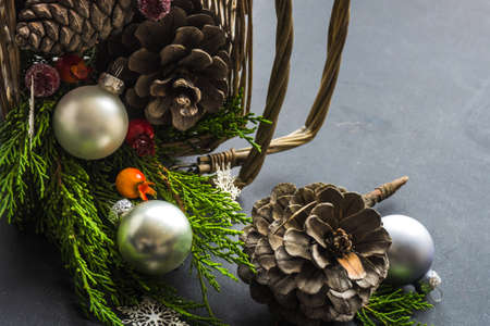 Festive Christmas concept with snow and decoration on rustic flatlay and frame with copyspaceの写真素材