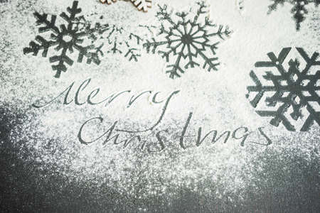 Christmas concept with  snowflakes on snowing background with copyspace