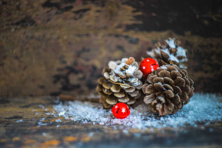 Concept with cones, snow and decoration for Christmas postcardの写真素材