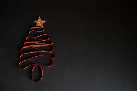 Christmas tree made with ribbon as a festive conceptの写真素材