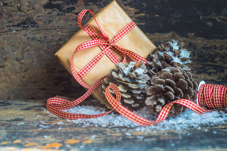 Concept with cones, snow and decoration for Christmas postcardの写真素材