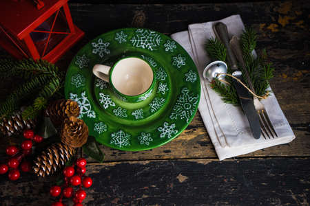 Festive table setting for holiday Christmas dinner on rustic background with copy spaceの写真素材