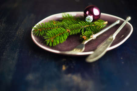 Festive table setting for holiday Christmas dinner on rustic background with copy spaceの写真素材