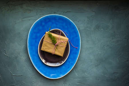 Festive table setting for holiday Christmas dinner on rustic background with copy spaceの写真素材