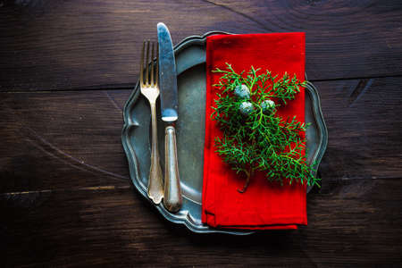Festive table setting for Christmas dinner on old wooden table with copyspaceの写真素材
