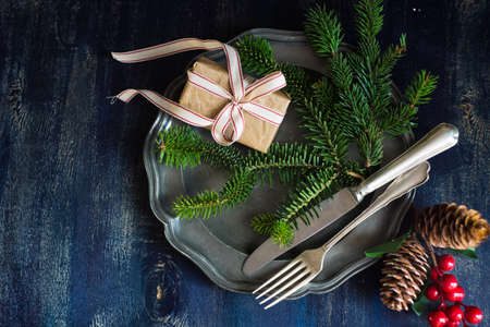 Festive table setting for holiday Christmas dinner on rustic background with copy spaceの写真素材