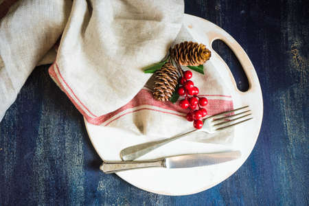 Festive table setting for holiday Christmas dinner on rustic background with copy spaceの写真素材